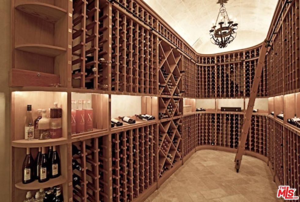 Wine cellar, Building, Room, Interior design, Lobby, Architecture, Ceiling, Furniture, Winery, Home, 
