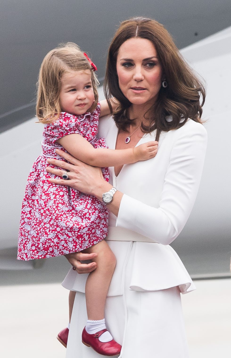 Catherine, Duchess of Cambridge, Princess Charlotte of Cambridge arrive at Warsaw airport during an official visit to Poland and Germany on July 17, 2017 in Warsaw, Poland.