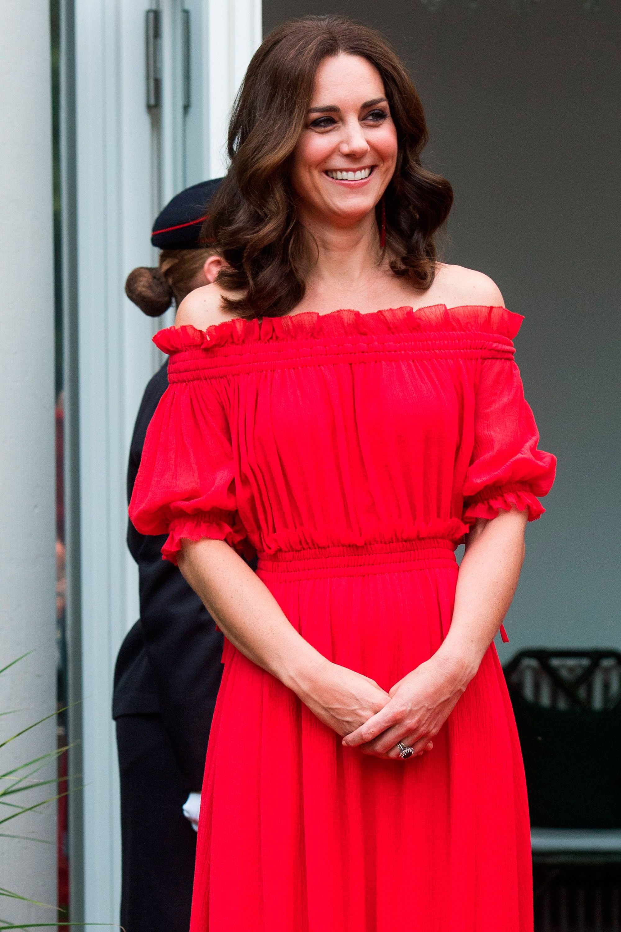 The Duchess of Cambridge wears red Alexander McQueen for a garden