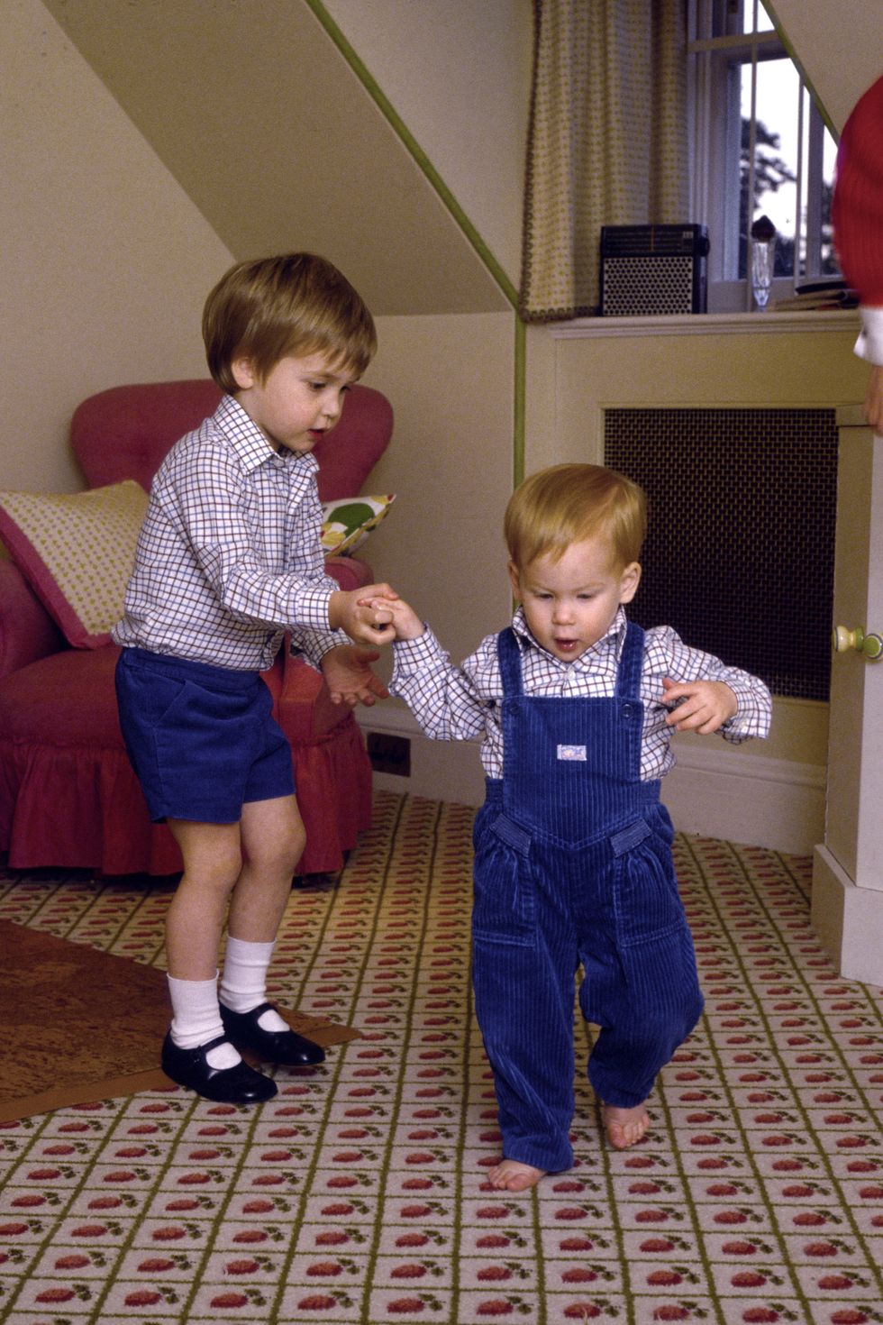 Prince William Attempting To Give His Baby Brother, Prince Harry, A Helping Hand As He Takes His First Steps At His Home, Kensington Palace