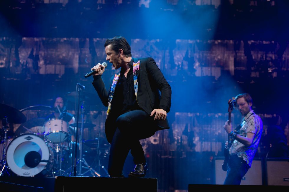 Ronnie Vannucci, Brandon Flowers, and Mark Stoermer of The Killers performs a surprise concert at Glastonbury Festival Site on June 25, 2017