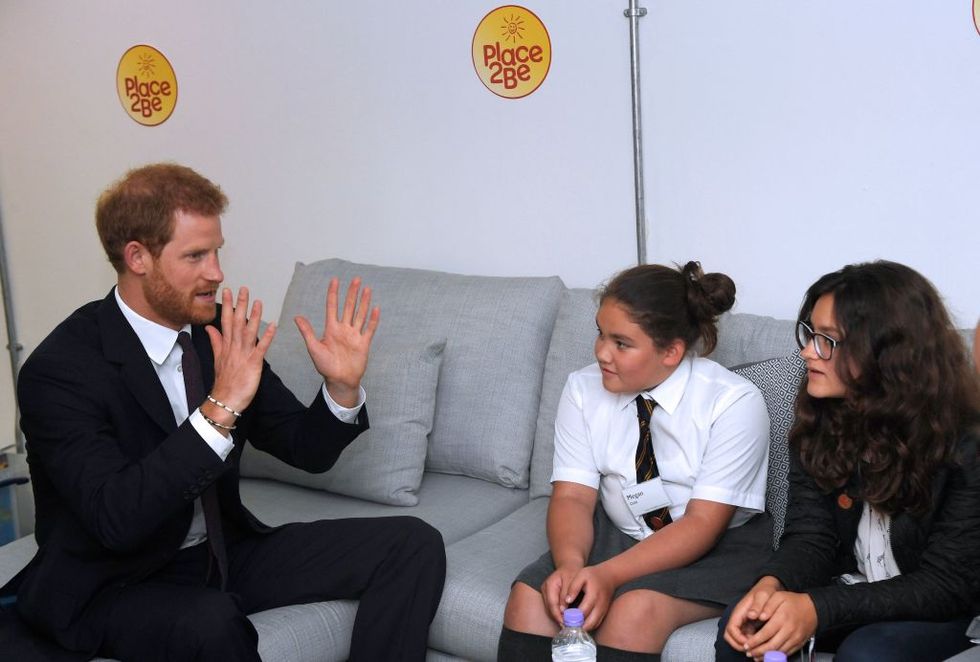 Prince Harry speaks to Grenfell Tower residents during a visit to the Support4Grenfell Community Hub