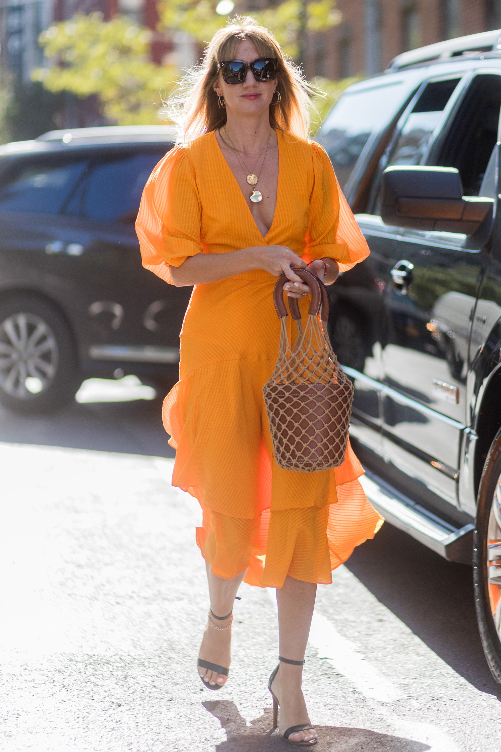 Orange discount handbag trend