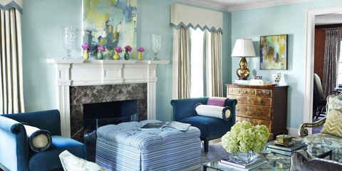 The celestial airiness of walls lacquered in Benjamin Moore's Antiguan Sky is grounded by a pair of Addison corner chairs from O. Henry House upholstered in Neptune-blue velvet — and covered in a Kravet fabric. Coffee table, Carole Gratale. Lamp, Christopher Spitzmiller.