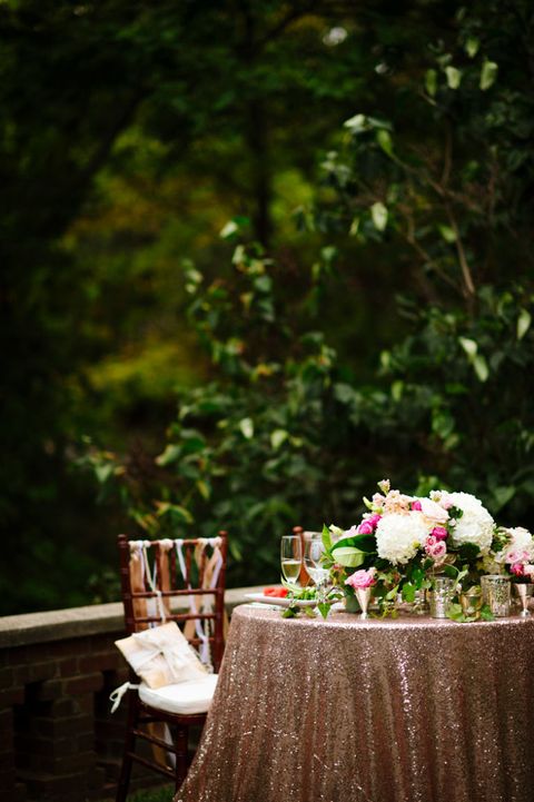 Don't skimp on sparkle when it comes to your linens, especially if you're taking the meal al fresco. Just keep the place settings simple and let the tablecloth shine.