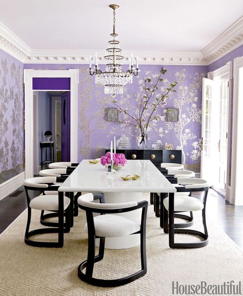 For the dining room of this <a href="http://www.housebeautiful.com/design-inspiration/house-tours/g2219/purple-house-design/">Massachusetts house</a>, Mary McGee designed a bold lacquered table and contemporary chairs that contrast with the delicate hand-painted Chinese wallpaper by Gracie. Door and transom upholstered in an Edelman leather. Room trim in Benjamin Moore's Ivory White.