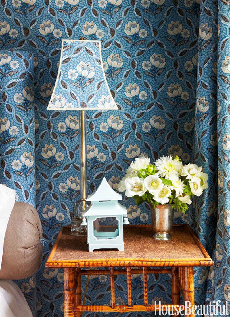 Blue bell shaped lamp on end table