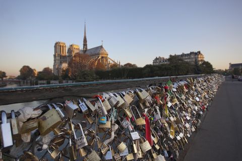 Padlocks clamped to the Pont de l'Archeveche bridge beside the Notre Dame de Paris, France