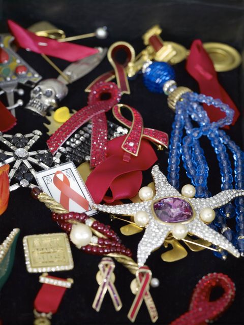 Metal, Craft, Body jewelry, Earrings, Ribbon, Souvenir, Symbol, 