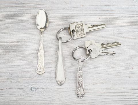 Kitchen utensil, Cutlery, Spoon, Household silver, Keychain, Metal, Silver, Still life photography, Chemical compound, Key, 