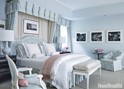 <p>￼The master bedroom is enveloped in a soothing sky blue. Bedding, Schweitzer Linen. Custom headboard. Lamp, Keramis. Bench upholstered in a Carleton V fabric. </p>