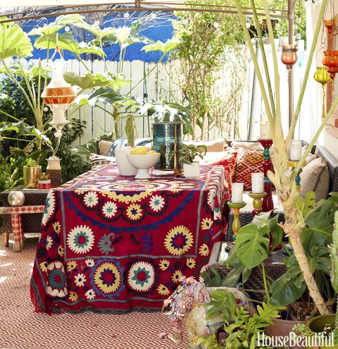 <p>Blakeney uses the outdoor dining area for both family meals and dinner parties. She found the vintage Uzbek Suzani tablecloth on      eBay. </p>