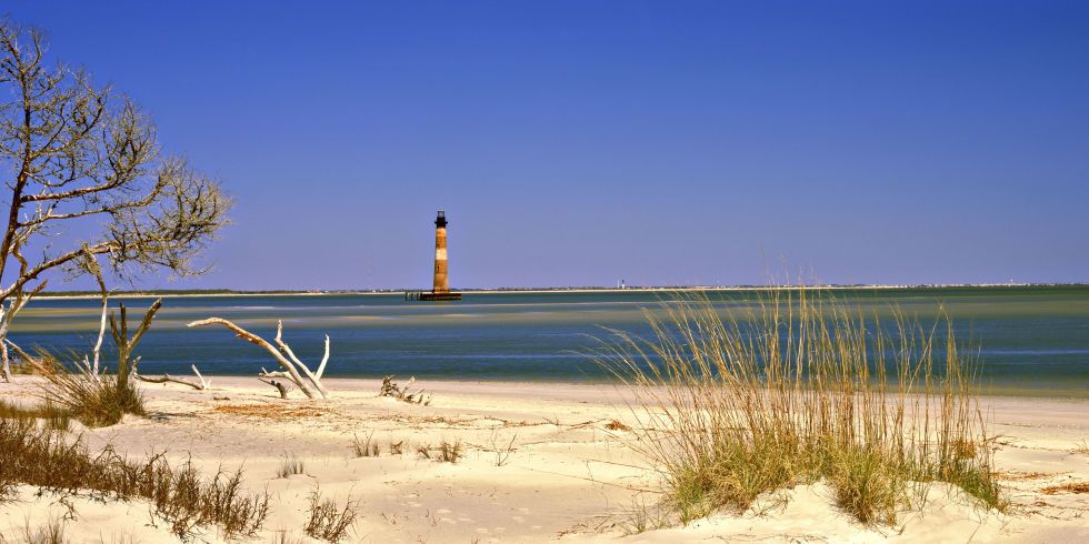 Lighthouse, Shore, Natural landscape, Natural environment, Sand, Beach, Sky, Water, Sea, Tower, 