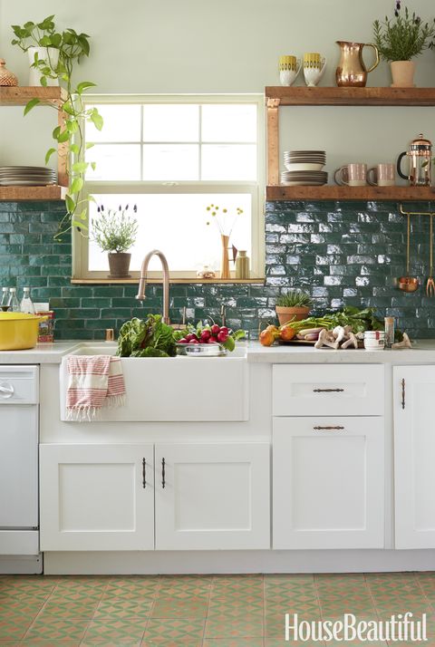 <p>Moroccan clay tiles from Badia Design cover the kitchen backsplash, and the wall is painted in Glidden's Silver Maple. </p>