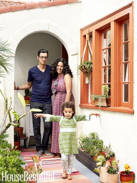 <p>Blakeney with her husband, Jason Rosencrantz, and daughter, Ida, age 3, stand before the archway of their front door. "This place is a real reflection of all three of us," Blakeney says. "Early on, I tried to do everything myself, but as soon as I invited them into the process, the house got prettier."</p><p><a href="http://www.housebeautiful.com/home-remodeling/interior-designers/q-and-a/a6490/justina-blakeney-jungalow-interview/" target="_blank">Read more about her inspiration for the home here</a>. For more details, <a href="http://www.housebeautiful.com/shopping/a6574/july-august-2016-resources/" target="_blank">see resources</a>.<br></p><p><em>This story originally appeared in the July/August 2016 issue of </em>House Beautiful.</p>