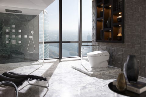 <p>Floor-to-ceiling windows overlooking the city are the key to breathtaking sights—and, thanks to stylish TOTO pieces and a zen vibe, the interior views of this bathroom are just as impressive.</p>