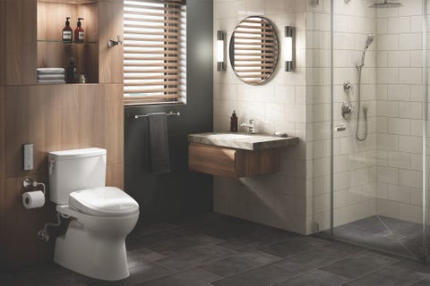<p>When all else fails, we believe in turning back to the basics—but the basics don't have to be boring. This chilled-out space, accented by TOTO fixtures, perfectly balances light wood walls and gray stone flooring with a deep green accent wall. </p>