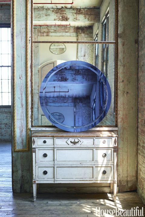 <p>The&nbsp;Round Blue Tinted mirror is&nbsp;by La Barge.&nbsp;</p>