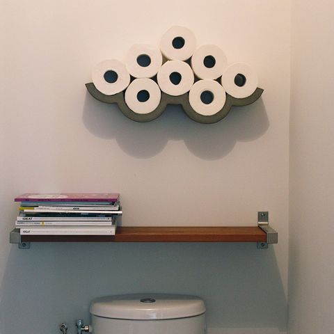 Shelf, Wall, Circle, Material property, Toilet, Room, Interior design, Toilet paper, Furniture, Office supplies, 