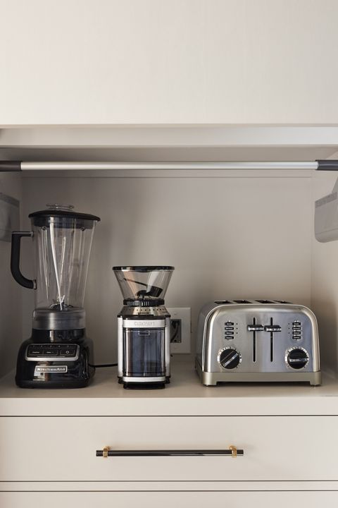 <p>Throughout the kitchen, there are a number of thoughtfully-designed hiding places for&nbsp;counter-hogging appliances. An "appliance garage" offers a clever solution to a typical countertop display, without having to lug something from storage or hunt for an outlet.</p>