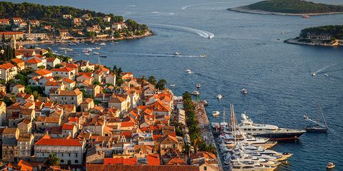 Water, Coastal and oceanic landforms, Coast, Town, Watercraft, House, Boat, Roof, Residential area, Sea, 