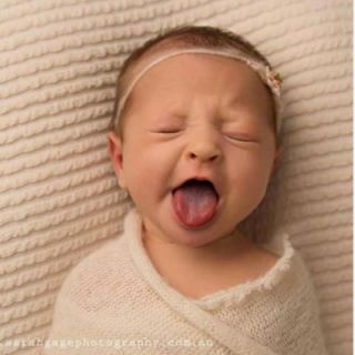 Child, Face, Baby, Skin, Baby making funny faces, Photograph, Nose, Facial expression, Cheek, Head, 