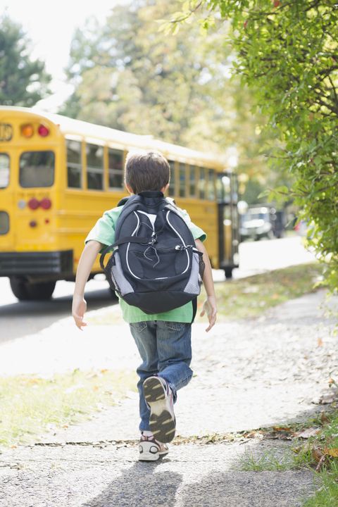 boy running to school bus