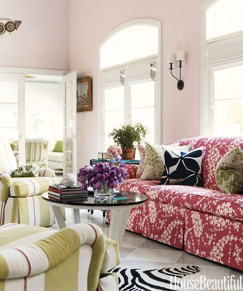 living room with patterns and pink walls