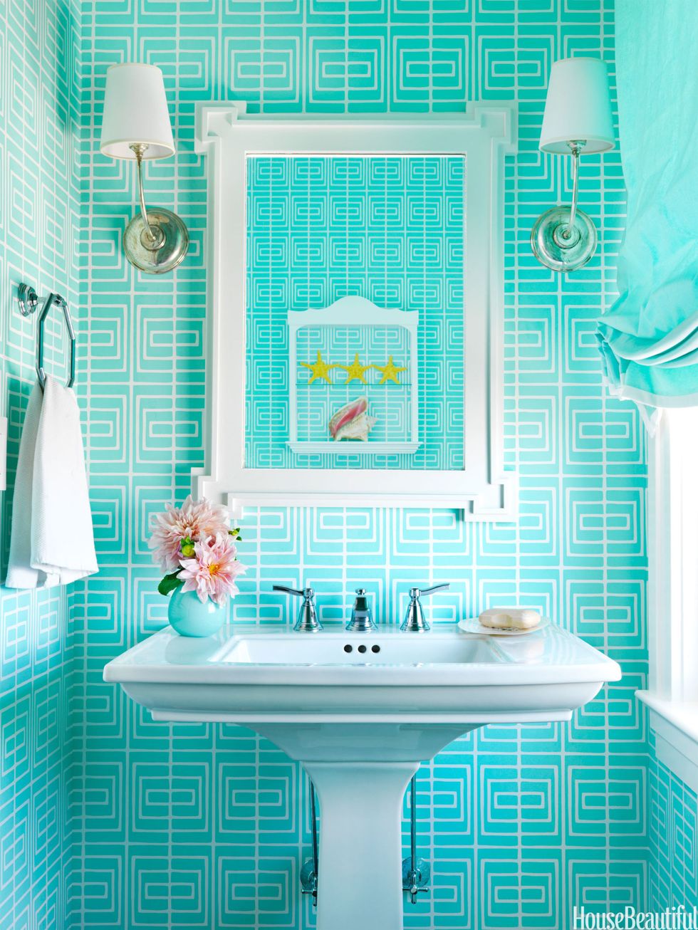 bath with bright blue wall covering