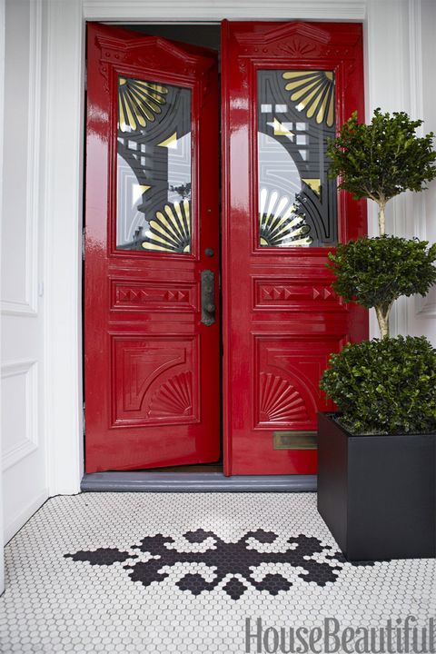 red front door with gold motif on glass