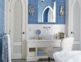 bathroom with blue tile and mosaic floor