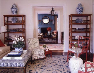 White living room with blue and white vases.