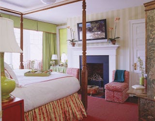 green bedroom with red accents