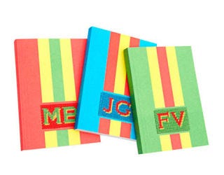 three colorful notebooks