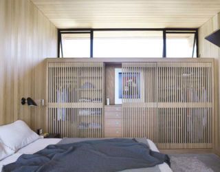 slatted closet doors in a modern master bedroom