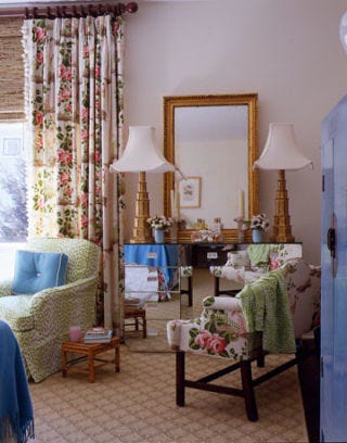 Mirrored dresser and lamps in bedroom.