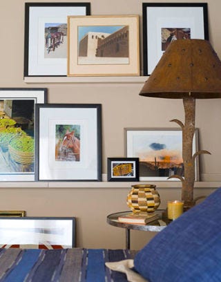 framed photos on guest bedroom wall