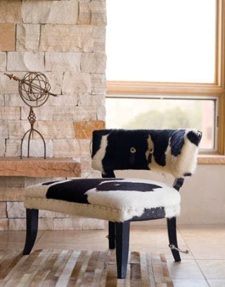 hide covered chair and sculpture