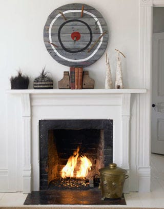 fireplace with artwork surrounding it