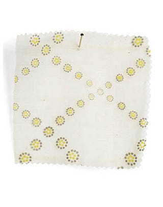 white fabric with yellow dots