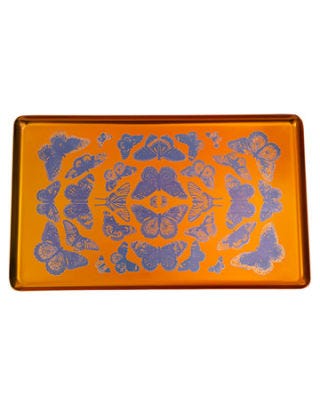orange metal tray with purple butterfly motifs printed