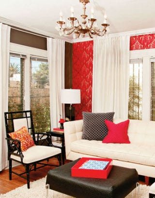 Venice Beach Living Room living room with white furniture and red patterned walls as well as black side tables and coffee table