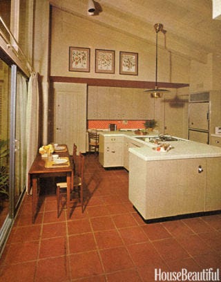 kitchen with high ceiling and glass doors onto garden room