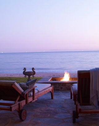 patio with lounge chairs and fire pit
