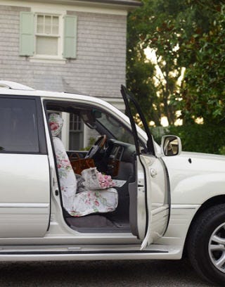 white car with rose print slipcovered seat