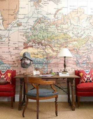boy bedroom with map covering wall behind desk