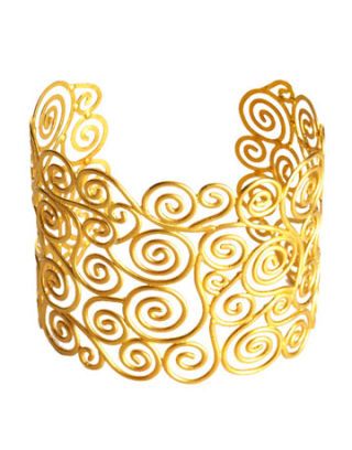 gold cuff with swirl design inspired by gustav klimt