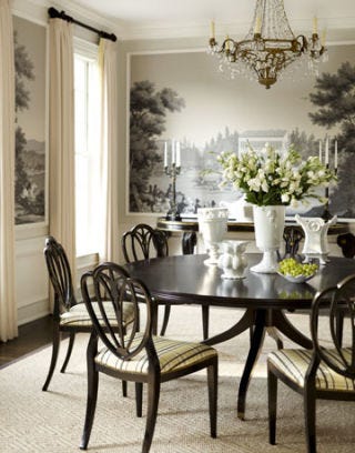 dining room with mural scenery wallpaper and a crystal chandelier
