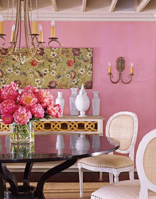 pink dining room with pink flowers on table