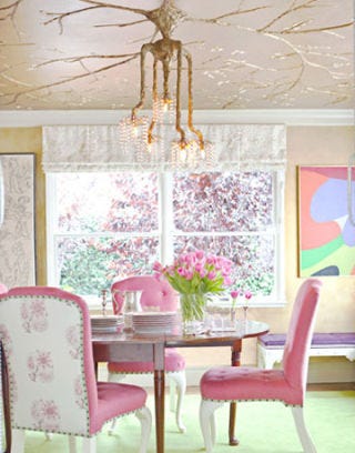 dining room with pink chairs and gold ceiling
